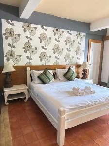 Кровать или кровати в номере Bhumiyama Plus +37 фотографий