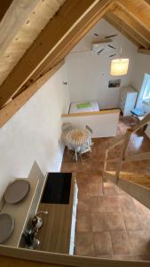an overhead view of a kitchen and living room at Villa rustica bougainvillea in Maslinica