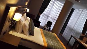 Postel nebo postele na pokoji v ubytování Livello Hotel
