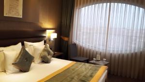 Postel nebo postele na pokoji v ubytování Livello Hotel