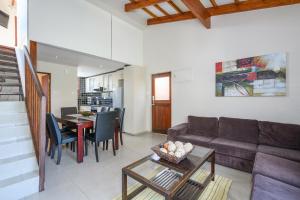 a living room with a couch and a table at San Lameer Villa's in Southbroom