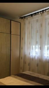 Ένα ή περισσότερα κρεβάτια σε δωμάτιο στο Tea apartman