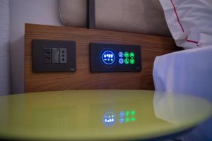 a room with a table and two electrical outlets at Best Western Plus Sabaudia Hotel in Sabaudia