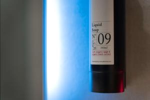 a bottle of wine sitting next to a refrigerator at Best Western Plus Sabaudia Hotel in Sabaudia