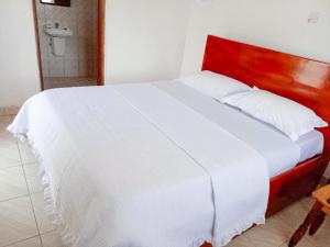 Postel nebo postele na pokoji v ubytování Agape House Kisoro