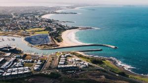 an aerial view of a beach and the ocean at Coastal Delight In Shellcove in Dunmore