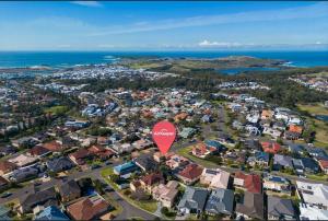 an aerial view of a suburb with a red stop sign at Coastal Delight In Shellcove in Dunmore