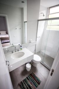 a bathroom with a sink and a toilet and a shower at Copacabana Best Deal Guest House in Rio de Janeiro