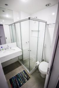 a bathroom with a shower and a toilet and a sink at Copacabana Best Deal Guest House in Rio de Janeiro