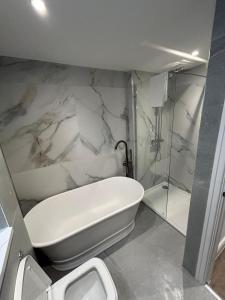 a bathroom with a toilet and a sink and a shower at 10 Hockenhall - Liverpool's Oldest House in Liverpool +26 photos
