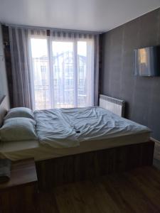 Voodi või voodid majutusasutuse Apartment on Stefan cel mare 16 toas