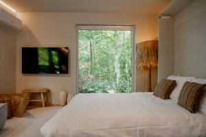 Postel nebo postele na pokoji v ubytování Luxe chalet met sauna in een oase van rust
