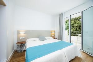 Posteľ alebo postele v izbe v ubytovaní Apartament Massanet 1c