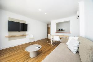 Televízia a/alebo spoločenská miestnosť v ubytovaní Apartament Massanet 1c