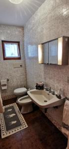 Koupelna v ubytování Appartamento con vista su pista Stelvio + 45 fotografií