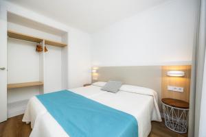 Posteľ alebo postele v izbe v ubytovaní Apartament Massanet 1c