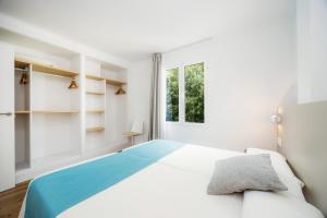 Posteľ alebo postele v izbe v ubytovaní Apartament Massanet 1c