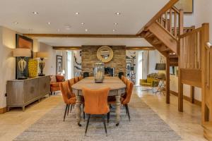 a dining room with a table and chairs at Hilltop View with Hot Tub in Brecon
