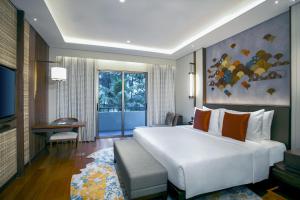 Postel nebo postele na pokoji v ubytování Mason Pine Hotel Bandung