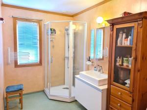 a bathroom with a shower and a sink at Comfortable house with balcony&Terrace and view in Kopervik