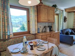 a kitchen with a table with food on it at Apartment Hermine by Interhome in Auffach