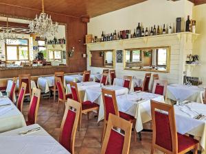 a dining room with white tables and chairs at Holiday Home Gästehaus Beretta by Interhome in Achenkirch