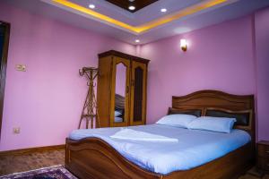 Postel nebo postele na pokoji v ubytování Homestay Book Now