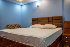 Postel nebo postele na pokoji v ubytování Homestay Book Now