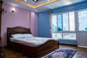 Postel nebo postele na pokoji v ubytování Homestay Book Now