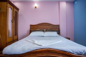 Postel nebo postele na pokoji v ubytování Homestay Book Now