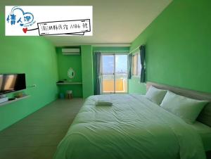 Letto o letti in una camera di 情人灣二館