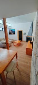 a living room with a table and a couch at Casa Acentejo in La Victoria de Acentejo