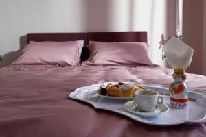 Кровать или кровати в номере Venere B&B