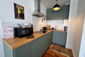 Η κουζίνα ή μικρή κουζίνα στο Appartement L’Éclat du Colza
