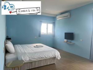 Letto o letti in una camera di 情人灣二館