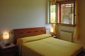 Postel nebo postele na pokoji v ubytování Agriturismo Podere Gozzuto