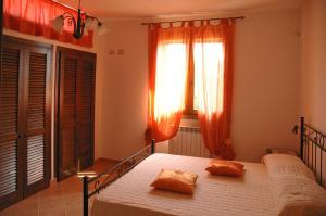 Postel nebo postele na pokoji v ubytování Agriturismo Podere Gozzuto