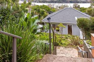 a house with a garden in front of it at Sensational Ocean Views In Maianbar in Maianbar