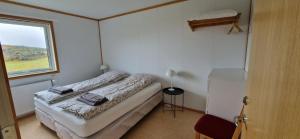 Postel nebo postele na pokoji v ubytování Skútustadir Guesthouse
