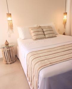 Ένα ή περισσότερα κρεβάτια σε δωμάτιο στο OCEAN BEACH STUDIO - Taipu de Fora