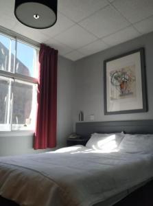 Postel nebo postele na pokoji v ubytování Citi Hotel Aberdeen