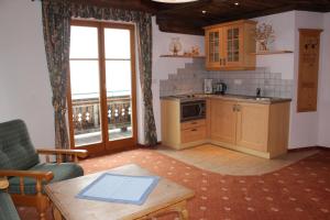 Kuchyň nebo kuchyňský kout v ubytování Himmelbauer Apartments