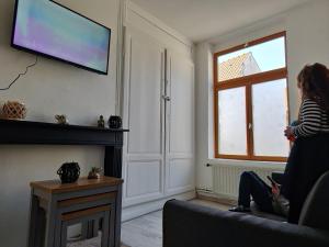 Televízia a/alebo spoločenská miestnosť v ubytovaní At Dream appartement