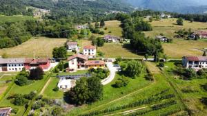 an aerial view of a small village in the mountains at B&B Dolomitincanto in Cesiomaggiore