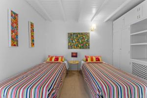 Postel nebo postele na pokoji v ubytování Evergreen Villa