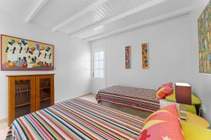 Postel nebo postele na pokoji v ubytování Evergreen Villa