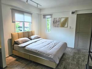 Postel nebo postele na pokoji v ubytování โรงแรมดีรูม D Room