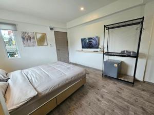 Postel nebo postele na pokoji v ubytování โรงแรมดีรูม D Room