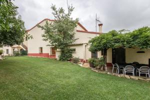 a house with a lawn in front of it at La Caseta in L'Ametlla del Vallès
