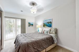 a bedroom with a bed and a window at Sunset Haven in Lodi